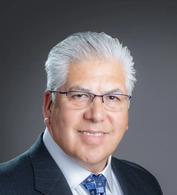 a man in a suit and tie posing for a picture