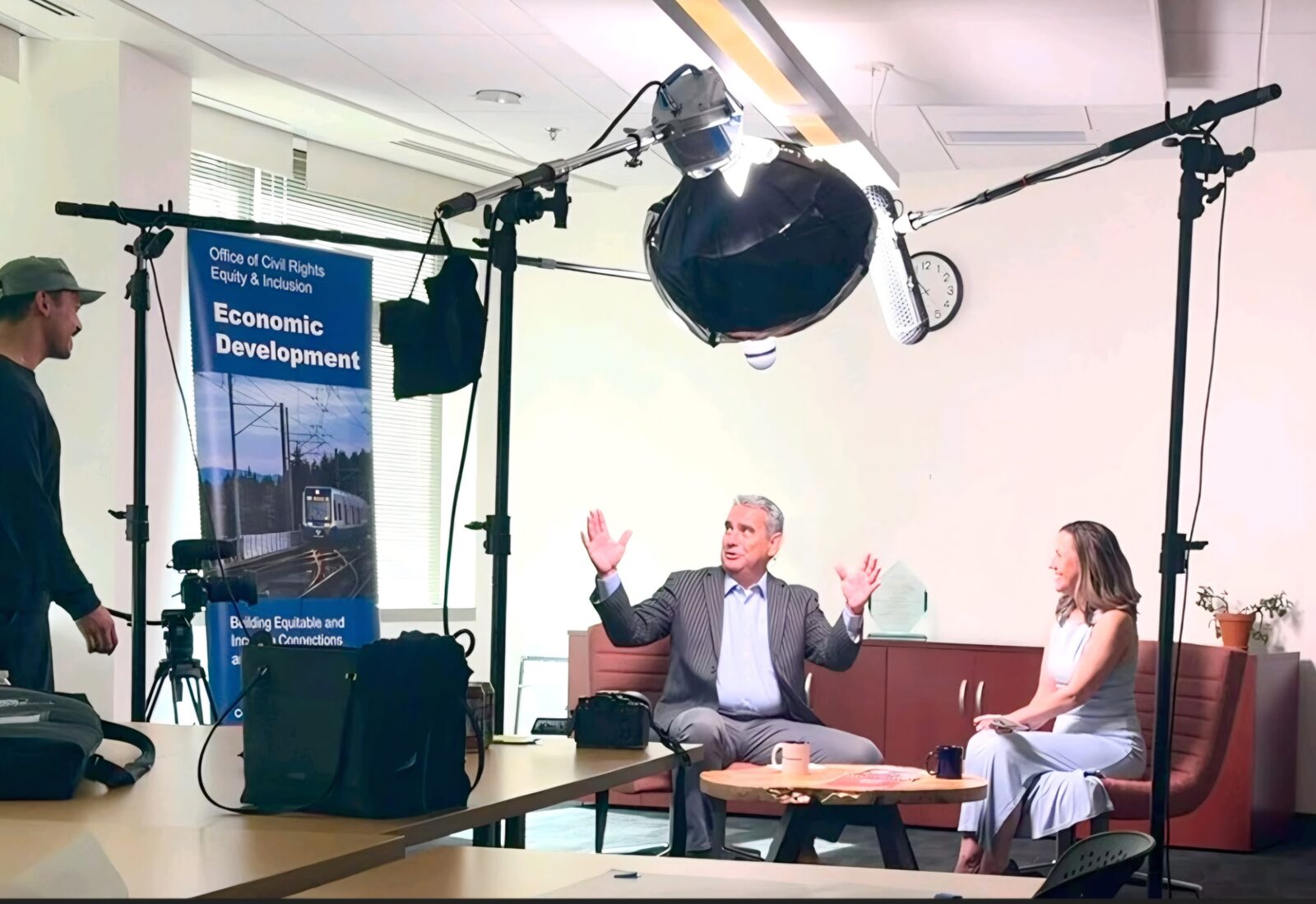 Cordoba's Randall Martinez is interviewed on camera at Sound Transit's Office of Civil Rights, Equity & Inclusion for the Capacity Building Mentorship Program.